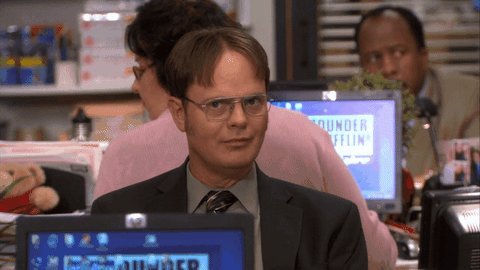 GIF of Dwight from the office putting his index finger up to his mouth and saying "Shhh"